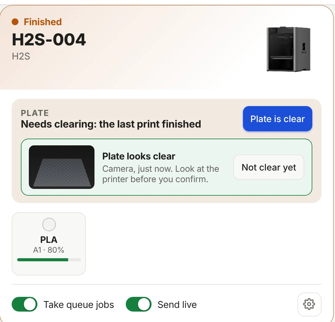 Plate check: the camera says the plate looks clear before the next job starts